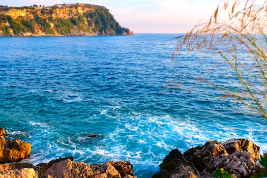 Breathtaking coastal seascape of Himarë, Albania with vibrant blue waters and rocky shores.