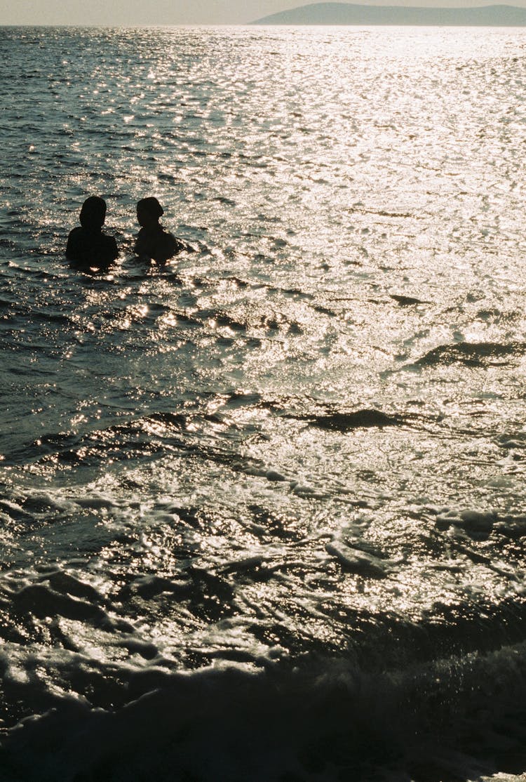 People Soaking On The Beach 