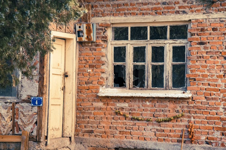 Abandoned House With Broken Window