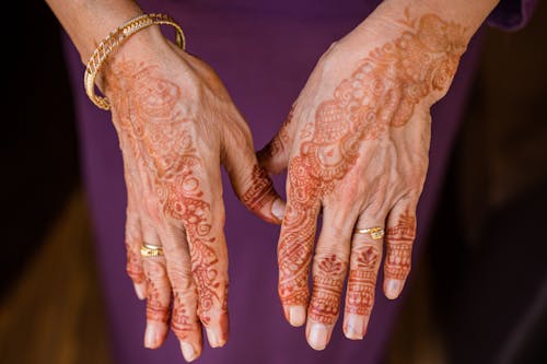Free Fading Henna Tattoo on Person's Hands Stock Photo
