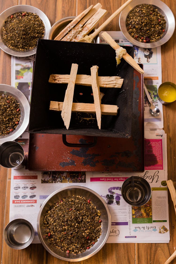 Bowls Of Herbs Surrounding Miniature Wood Stove