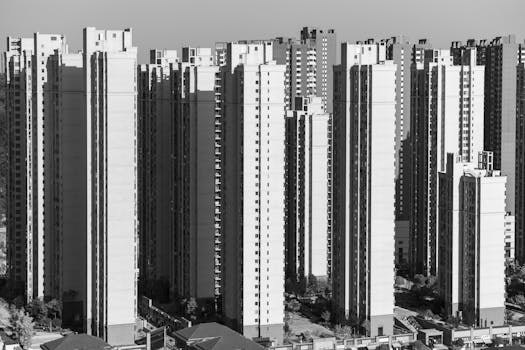 Stunning black and white view of towering modern residential buildings.