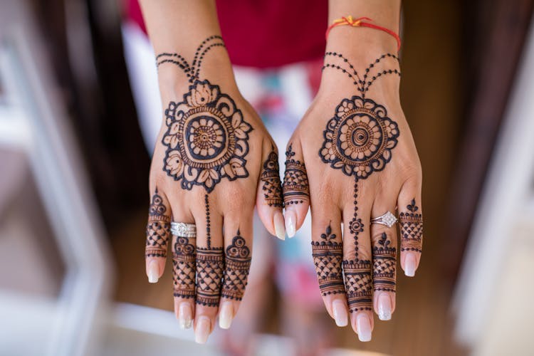 Woman With Mehndi On Hands