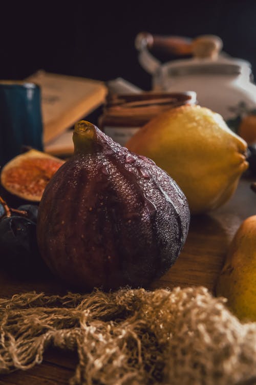 Yellow and Brown Fruit on Brown Wooden Surface