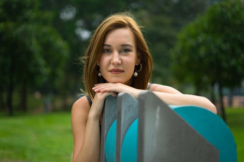 Woman Leaning on Wall at Park