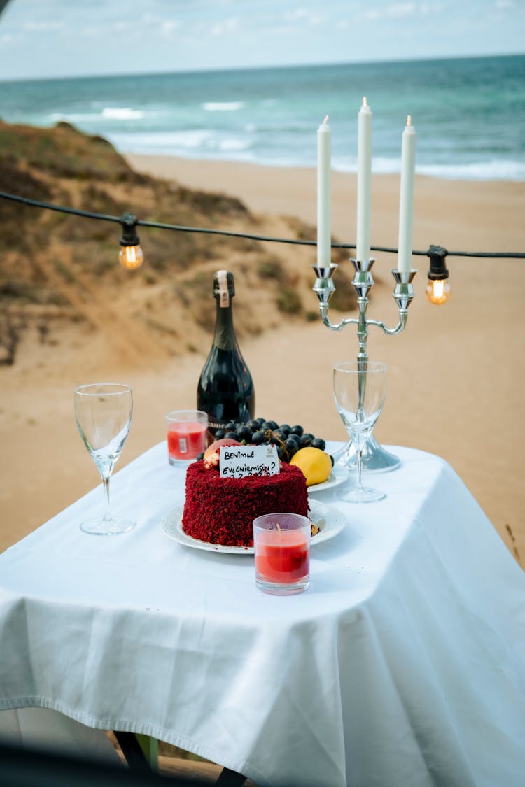 Table With Candles Set At A Beach 