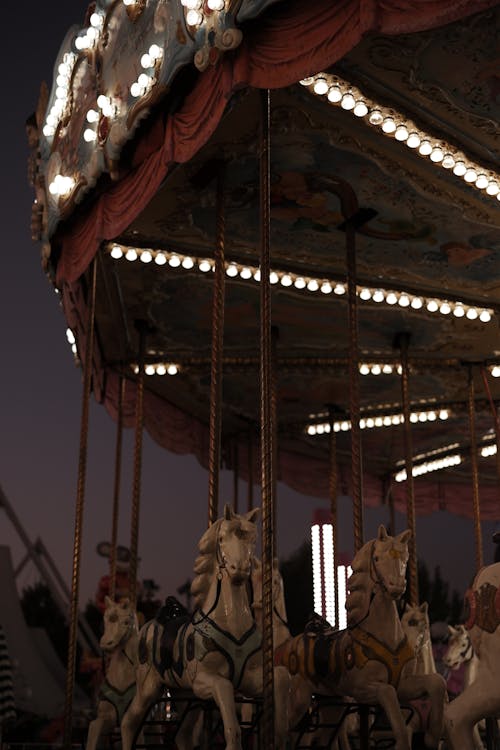 Vintage Carousel with Horses at Dusk 