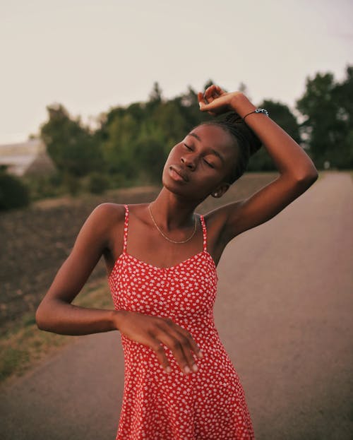 Woman Wearing a Summer Dress Posing Outdoors
