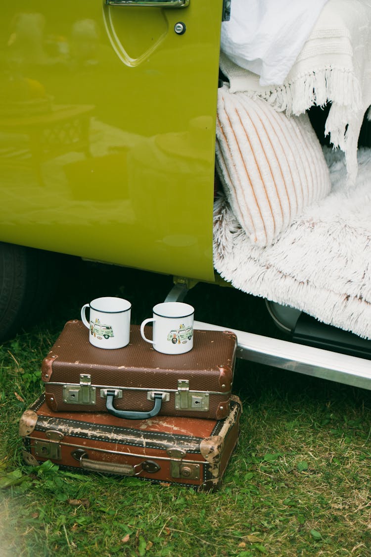 Mugs On Stacked Briefcases