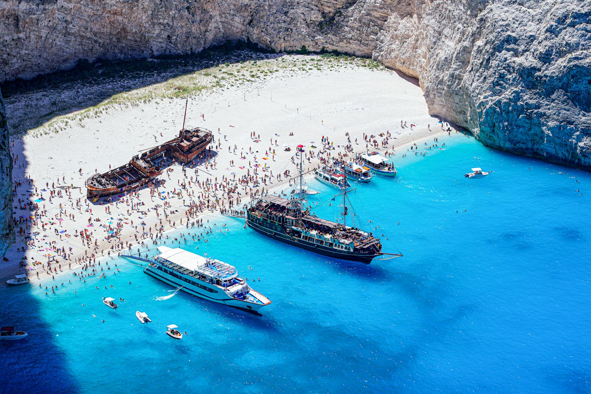 Stunning aerial photo of Navagio Beach with a shipwreck and clear blue waters.