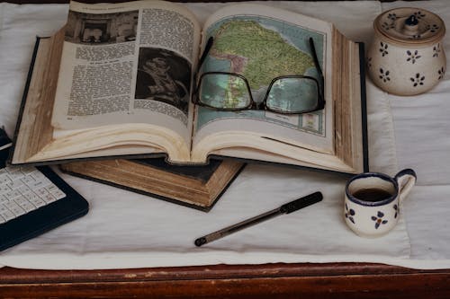 Eyeglasses on Top of a Book