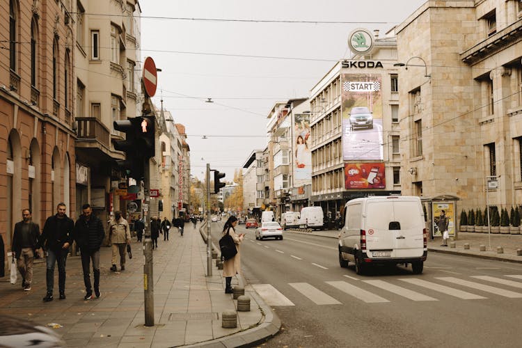 Photograph Of People Near A Road