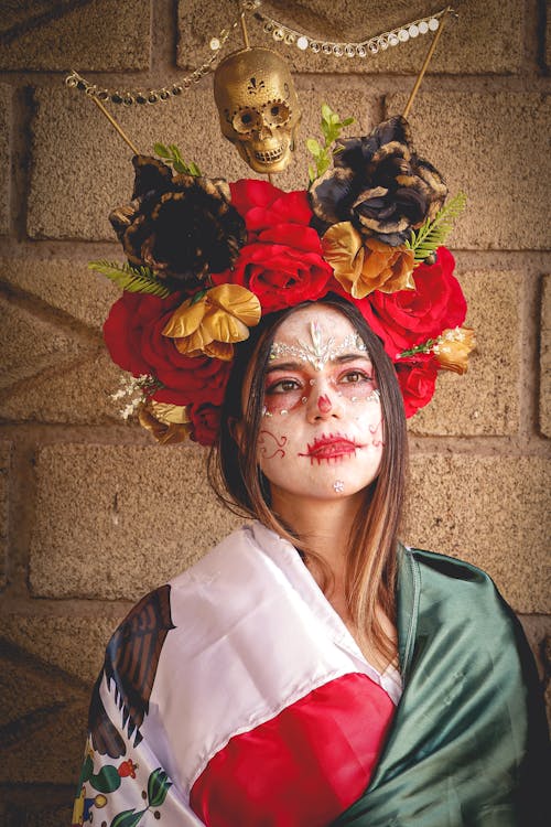 A Woman with a Face Paint Wearing a Headdress