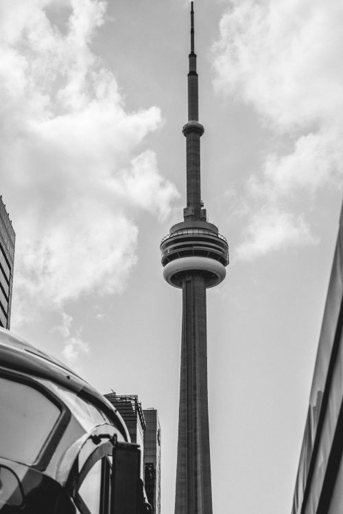 Free Black and white photo of CN Tower reaching into the sky, Toronto landmark. Stock Photo