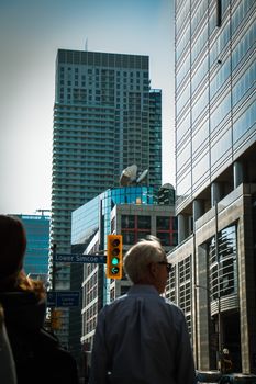 Dynamic urban scene featuring modern high-rise buildings and a traffic intersection.