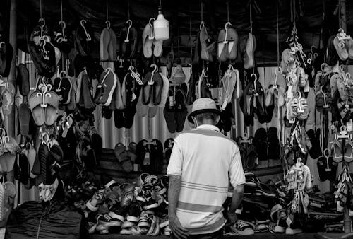 Back View of a Man Looking at a Shoe Store