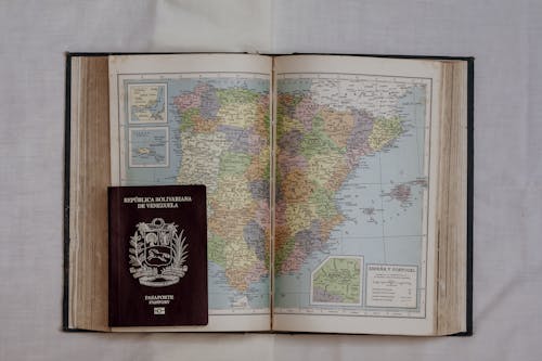 A Passport on a Book with a Map of Spain