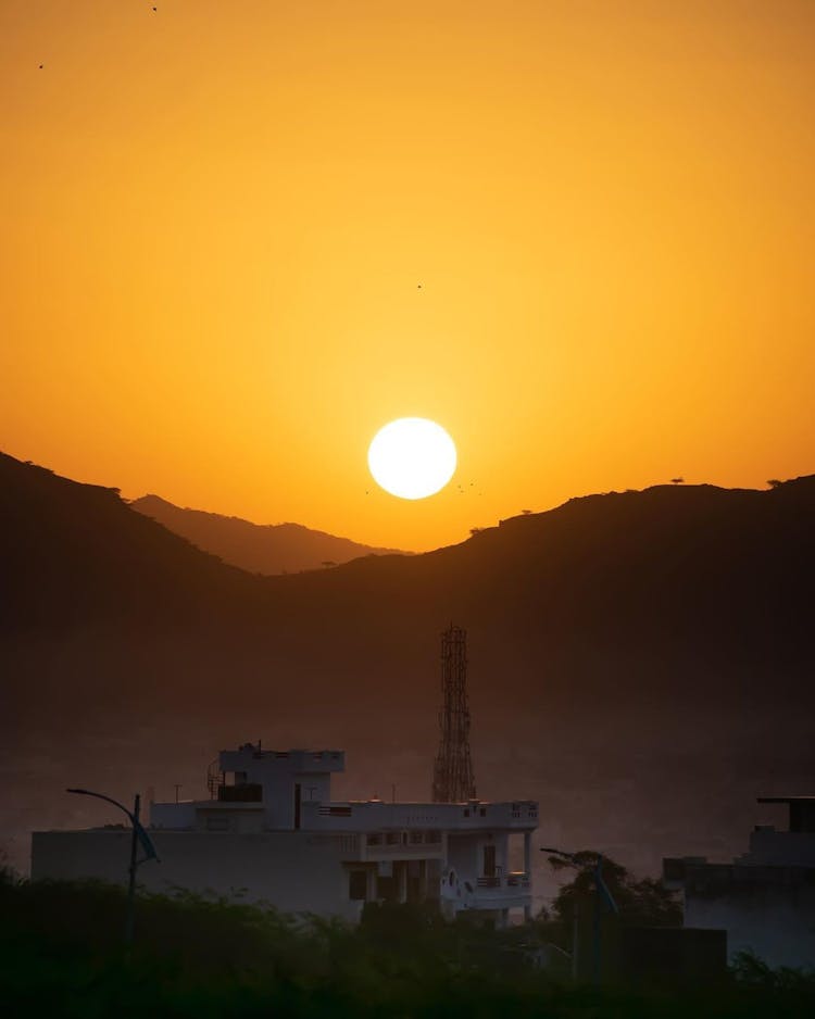 The Sun Setting Over Mountains