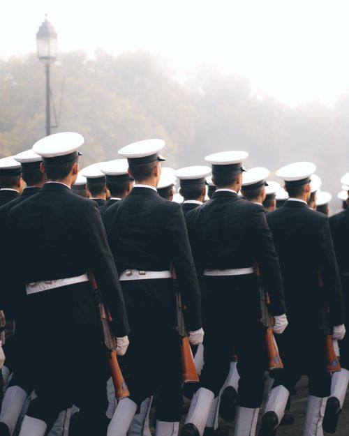 Free Soldiers in formal uniform march in a disciplined military parade outdoors. Stock Photo