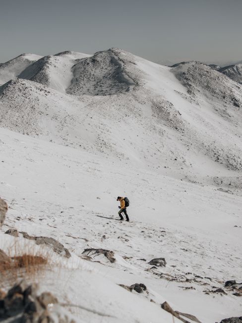 Explore the solitude and beauty of winter hiking in the Albanian mountains.