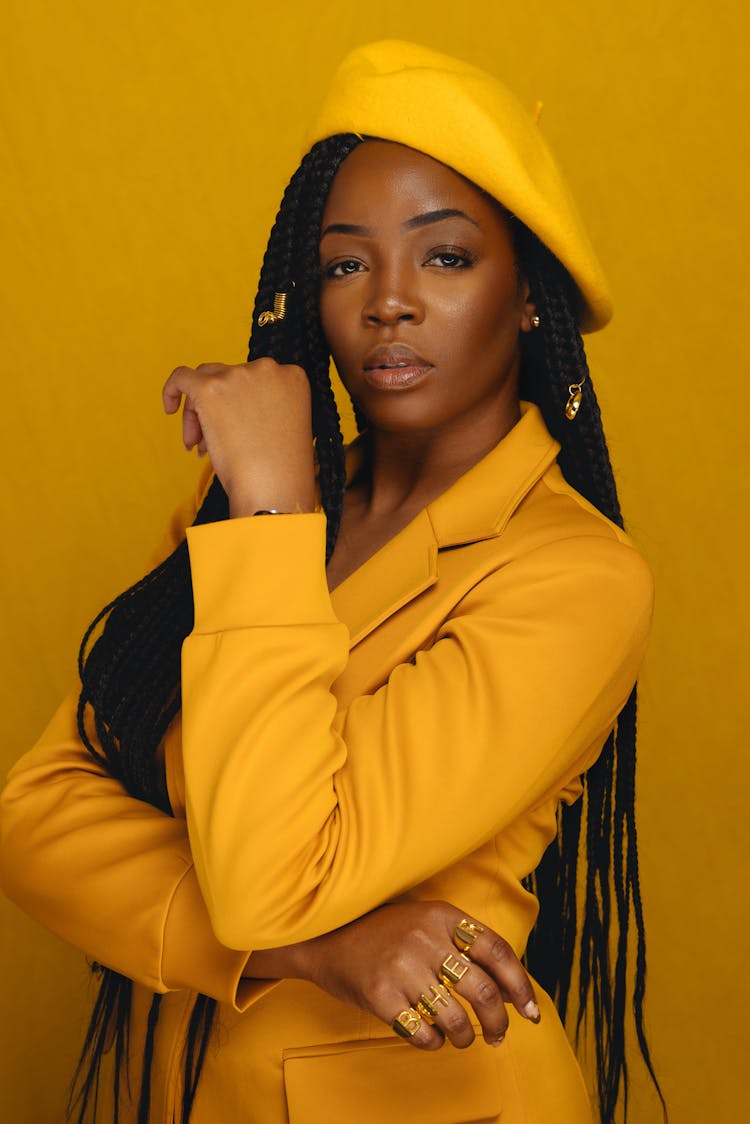 Woman Wearing All Yellow Posing In A Studio 