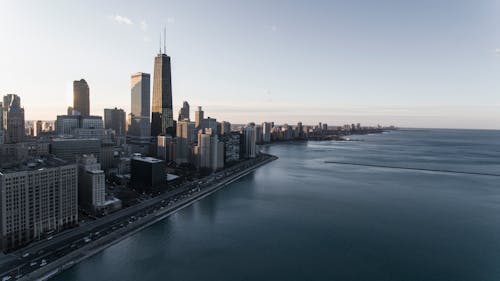 Photo of Gray High Rise Buildings Near Body of Water