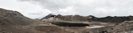 Brown Mountain Under Cloudy Sky