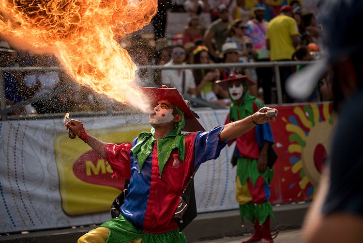 Man Blowing Fire At A Festival 