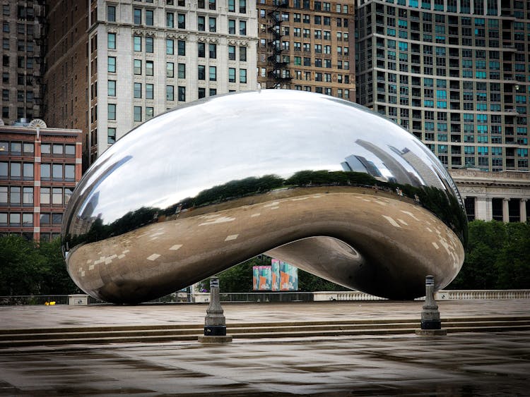 The Bean With Reflections Of Trees And Buildings In Chicago, Illinois, United States