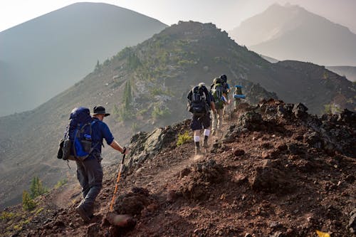 Free Group of Person Walking in Mountain Stock Photo