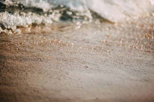 Selective Focus Photography of Brown Sand