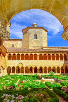 Beautiful cloister and garden within the historic Santo Domingo de Silos Monastery in Spain.