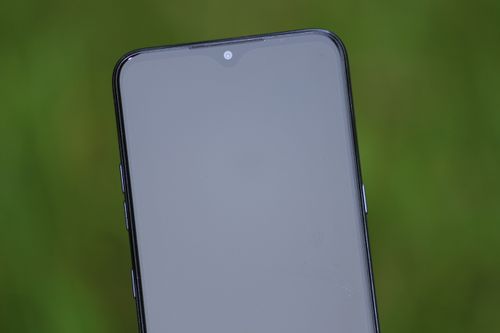 Free Close-up view of a smartphone screen with a green background, ideal for tech themes. Stock Photo