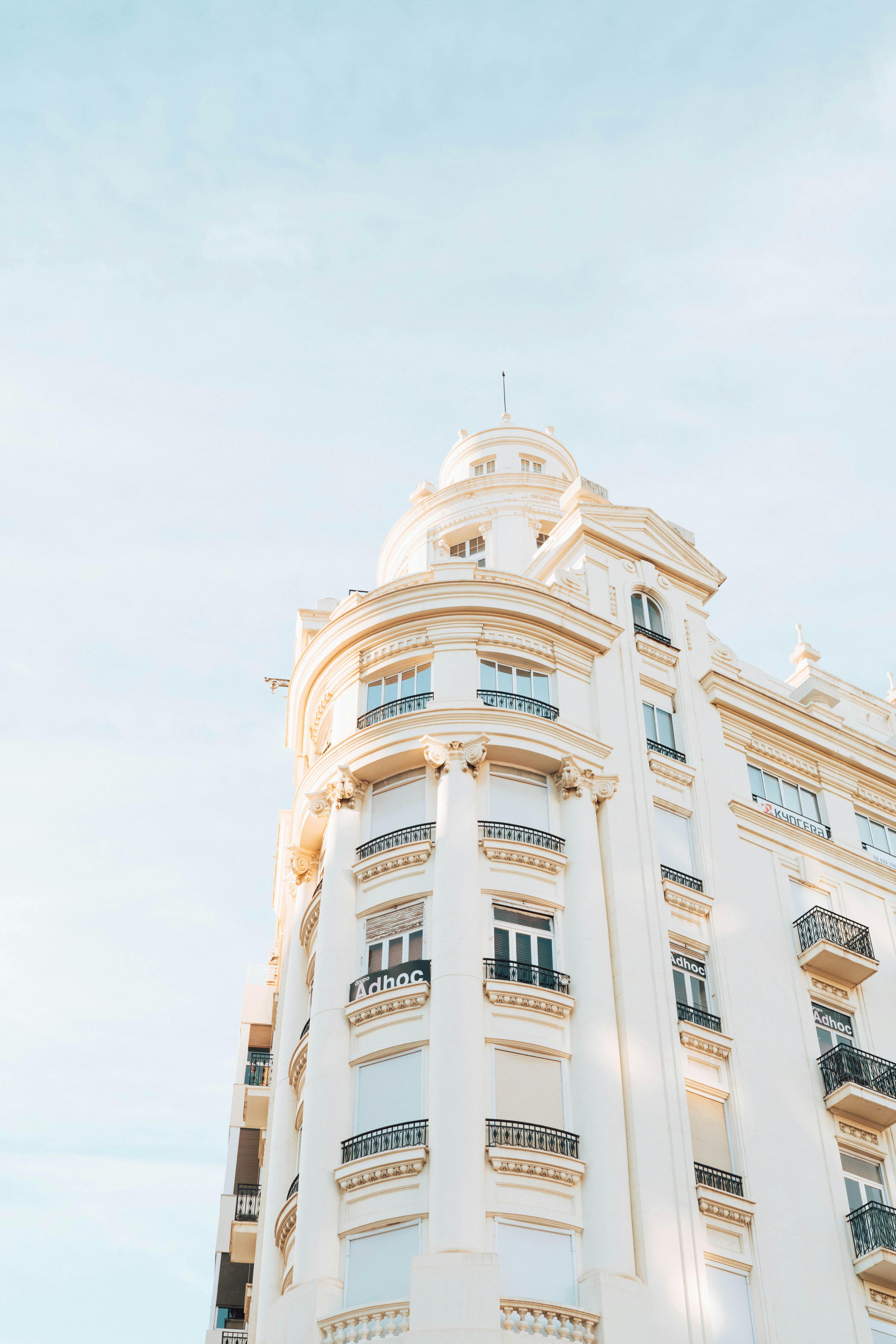 Elegant white building in Valencia, Spain under a clear blue sky. Perfect urban architecture scene.