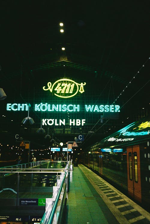 Neon Lights Sign Inside a Railway Station
