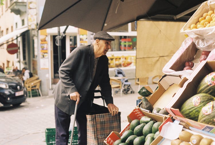 Elderly Man Buying Fruits