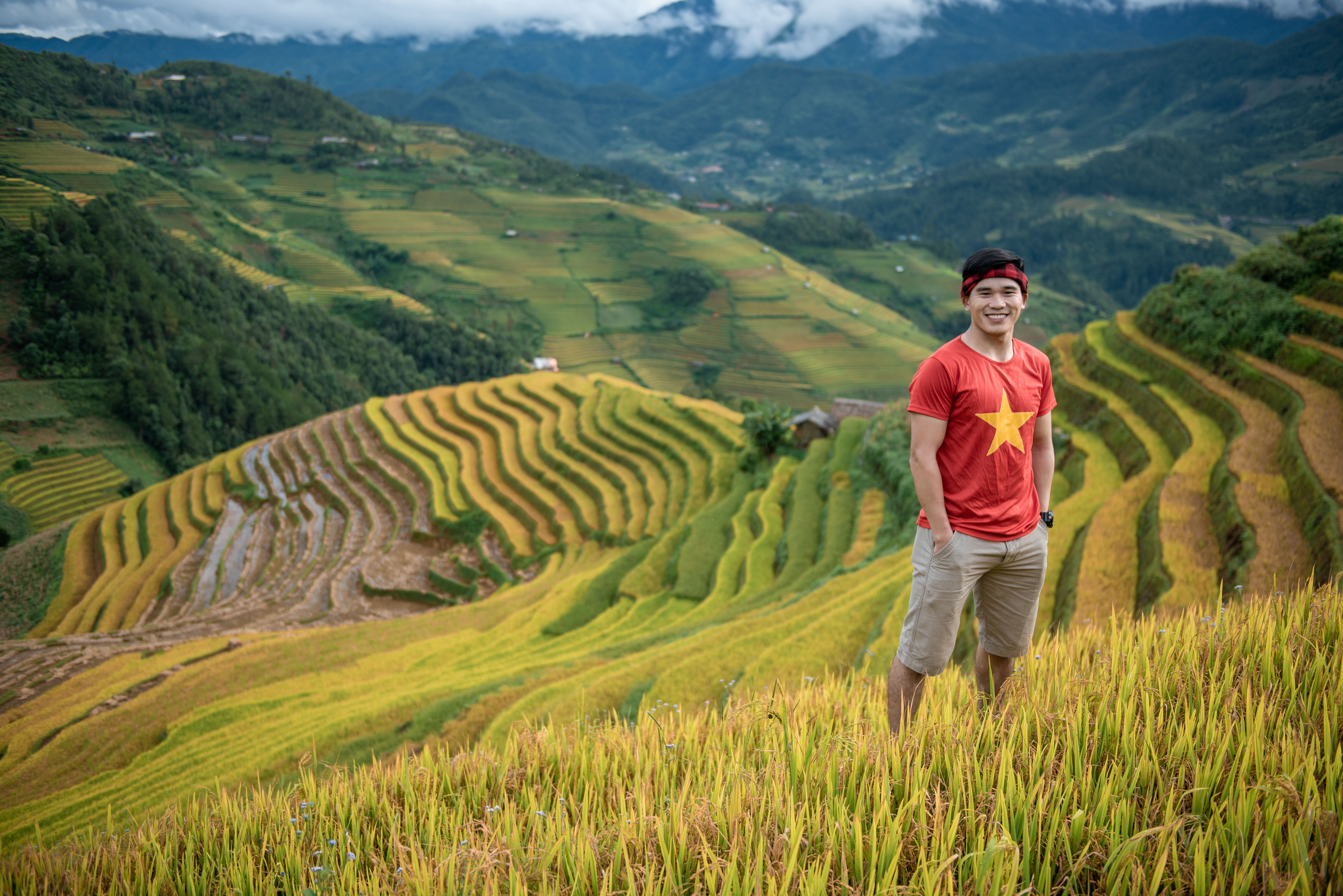 A Man in Red Shirt Standing on Green Grass Field · Free Stock Photo