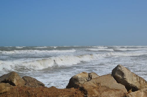 An Ocean Waves Crashing on a Rocky Shore