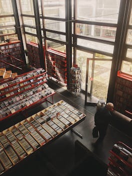 High-angle view of a modern music store with CDs and open glass door.