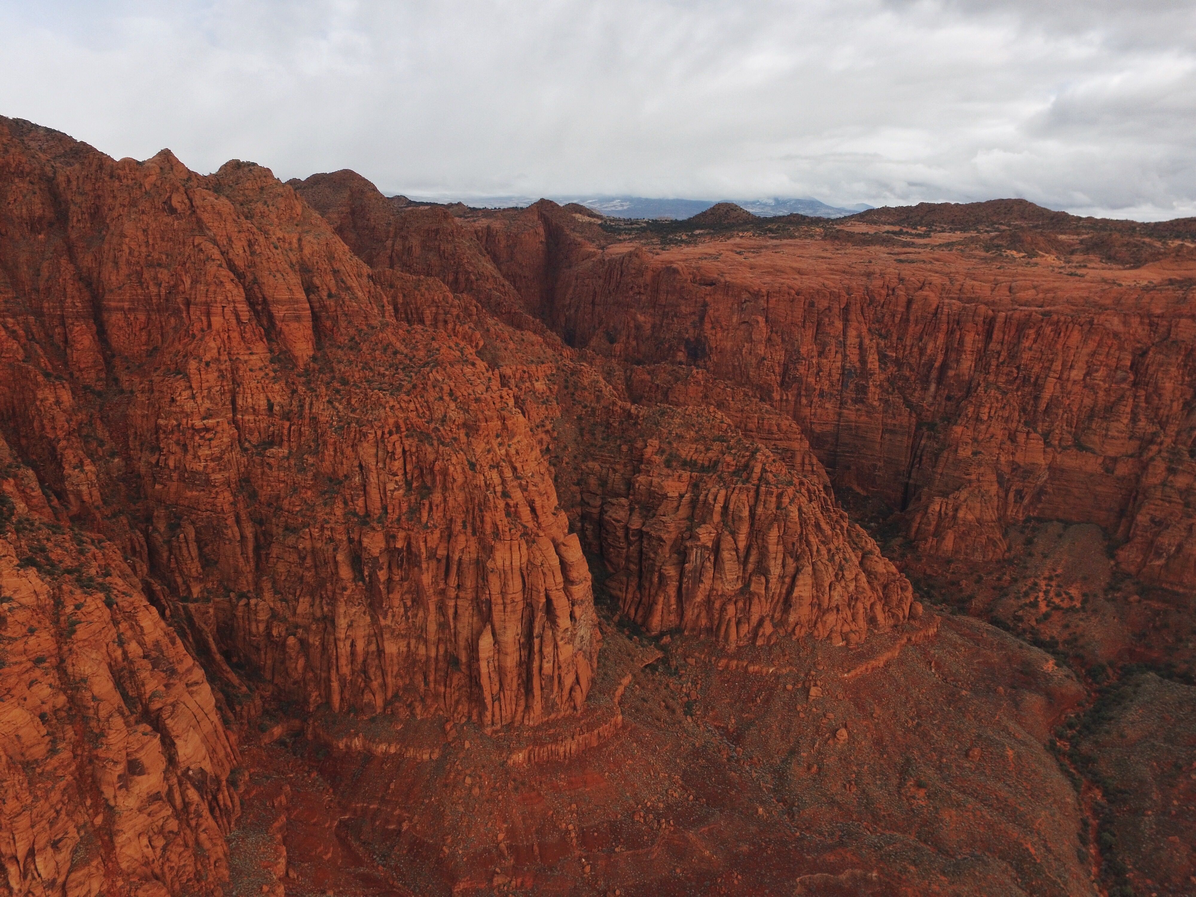 Mountain landscape in Southern Utah with red rock formations and blue sky