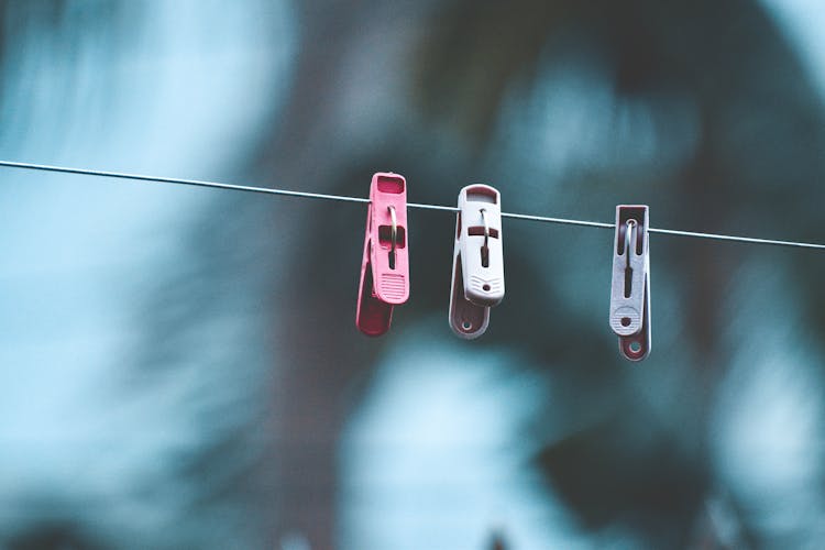 Three Clothespins On Clothesline