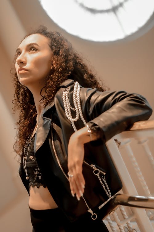 Woman in Black Leather Jacket Looking Up