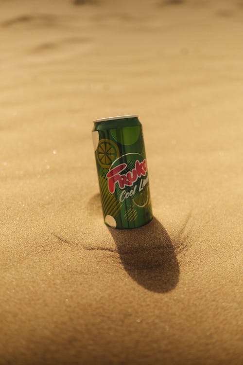 Can of Lime Soda in Sand