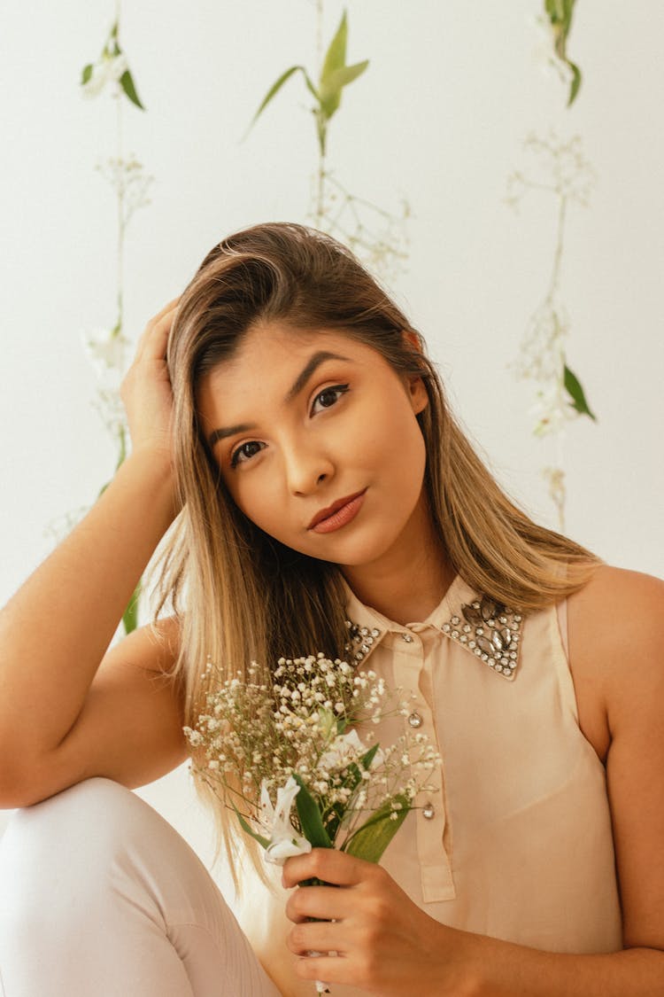 A Woman Holding A Flowers