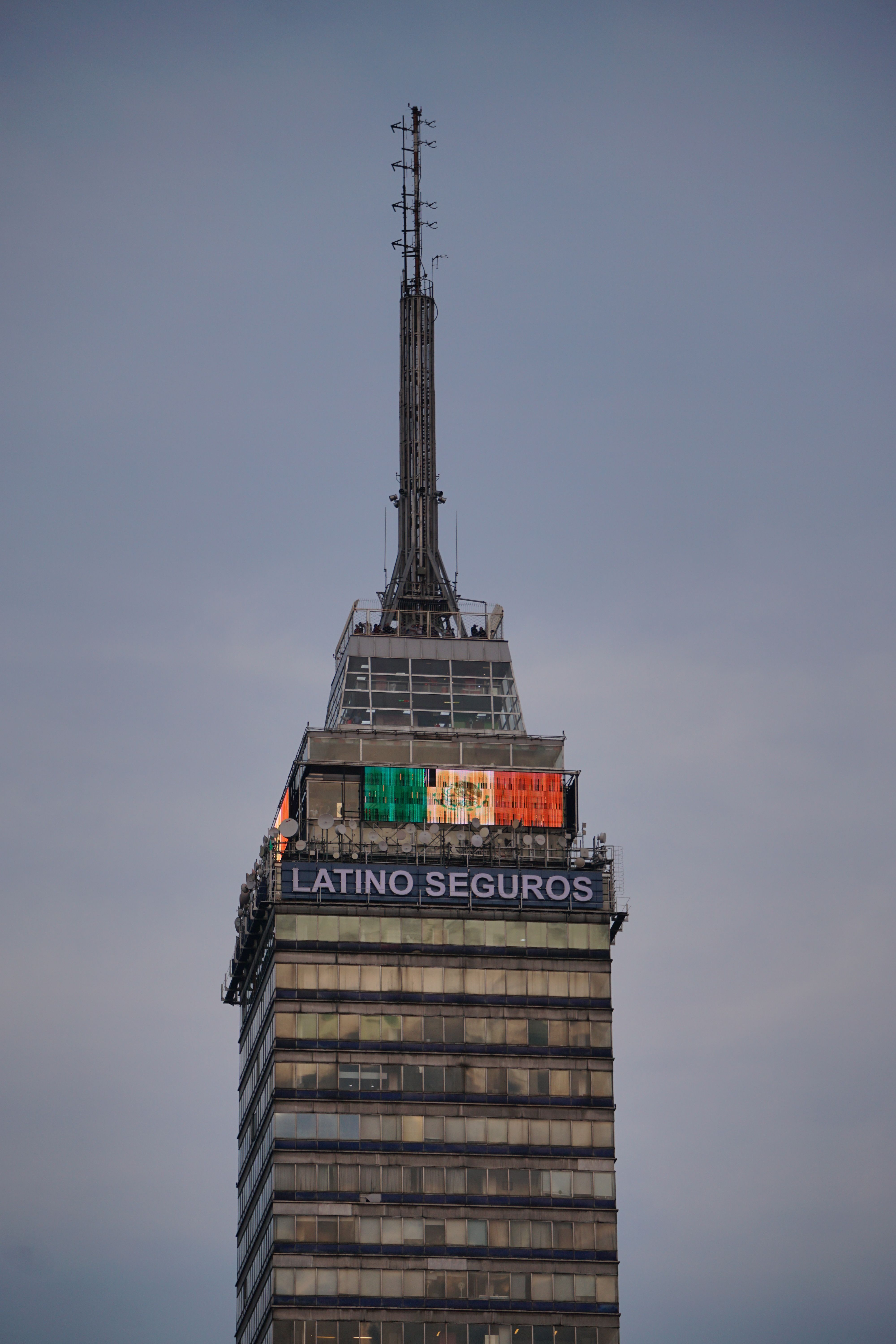 Close-up of Torre Latinoamericana against a clear blue sky in Mexico City.