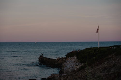 Flag on Sea Coast at Dusk