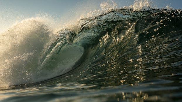 Captivating close-up of a powerful ocean wave crashing, showcasing nature's force and beauty.