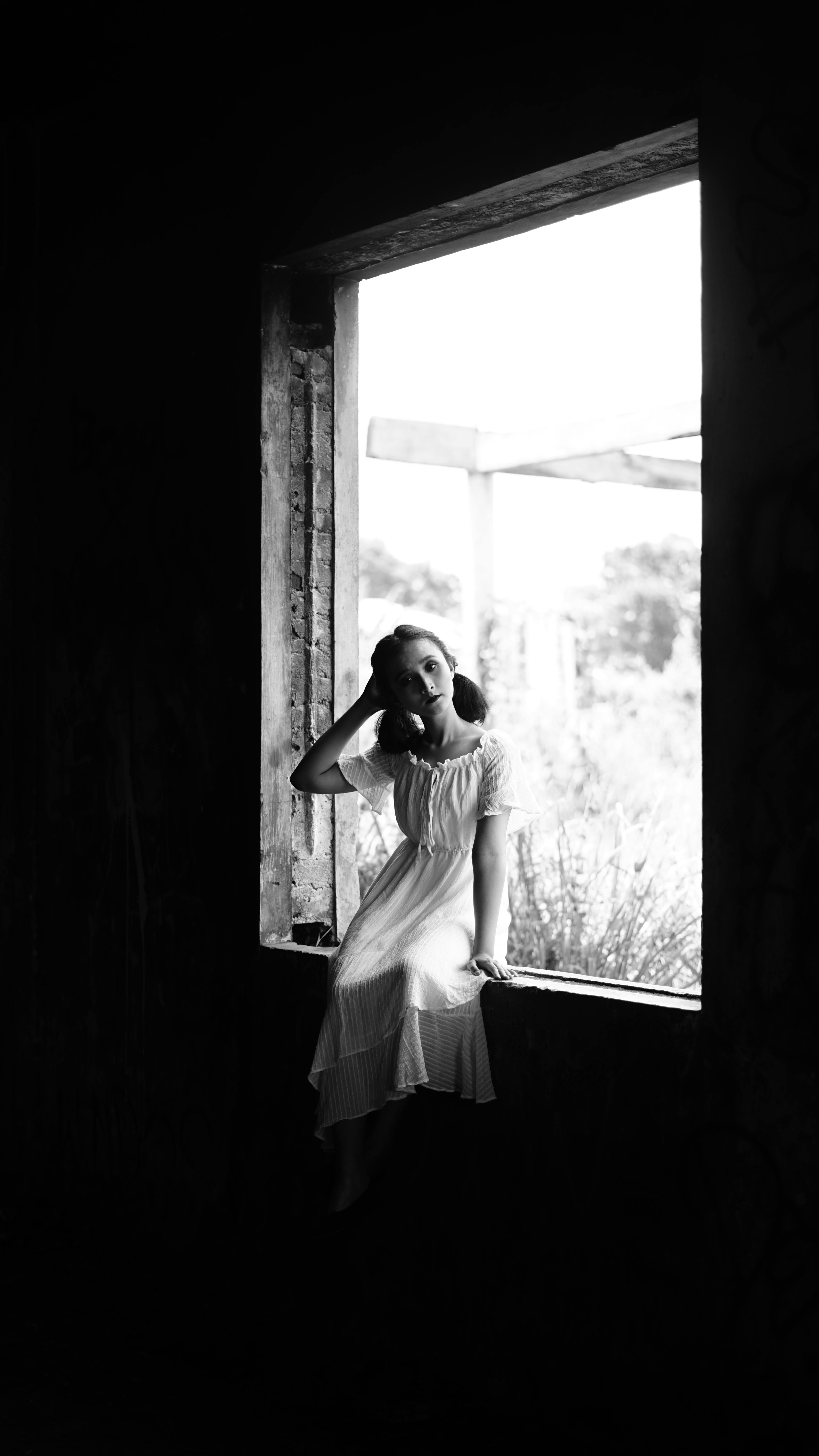 Child Sitting on Bricks on Construction Site · Free Stock Photo