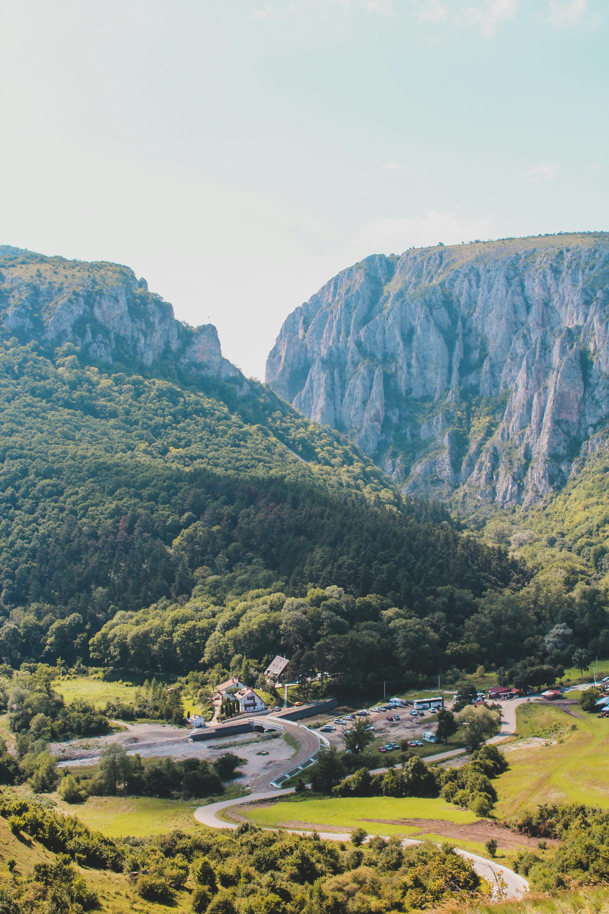 green mountains under white sky