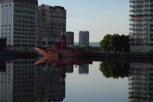 Free Body of Water Near High Rise Buildings Stock Photo